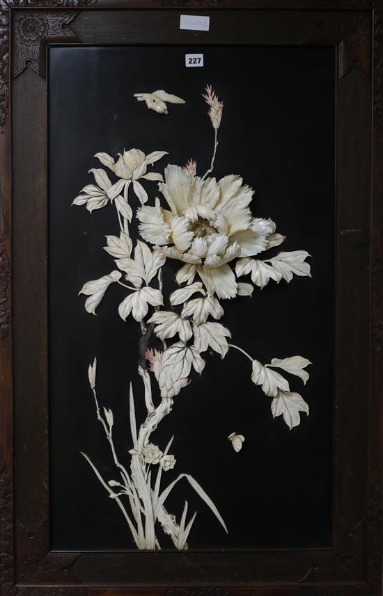 A Japanese panel with carved ivory flowers 107 x 70cm